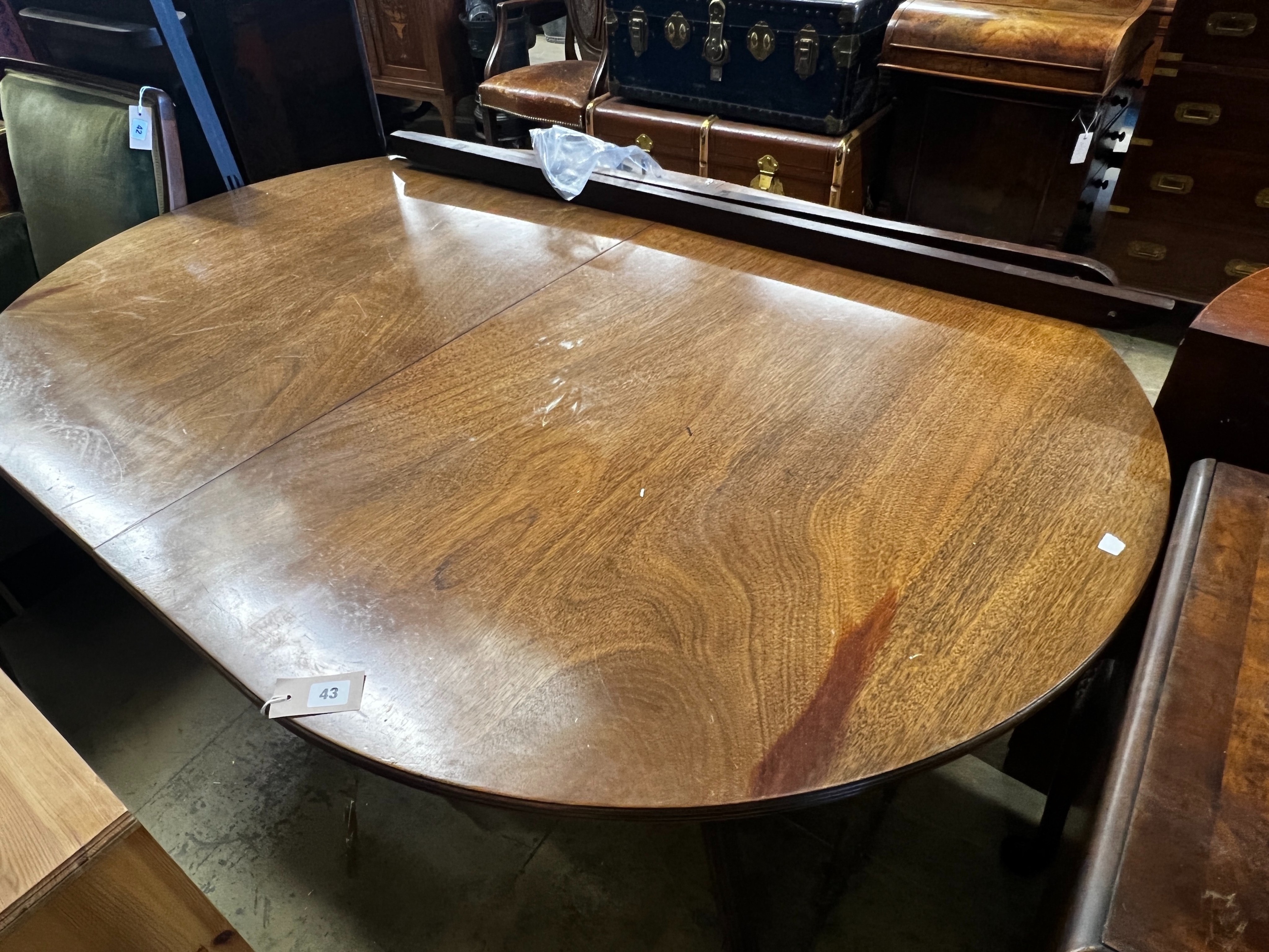 A George III style mahogany twin pedestal D end extending dining table, length 158cm, 248cm extended, two spare leaves, width 110cm, height 72cm